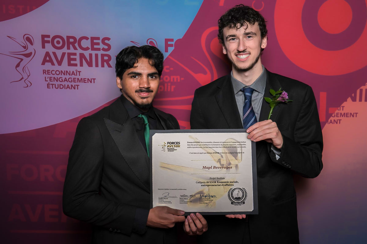Mapl Soda co-founders holding an entrepreneurship award